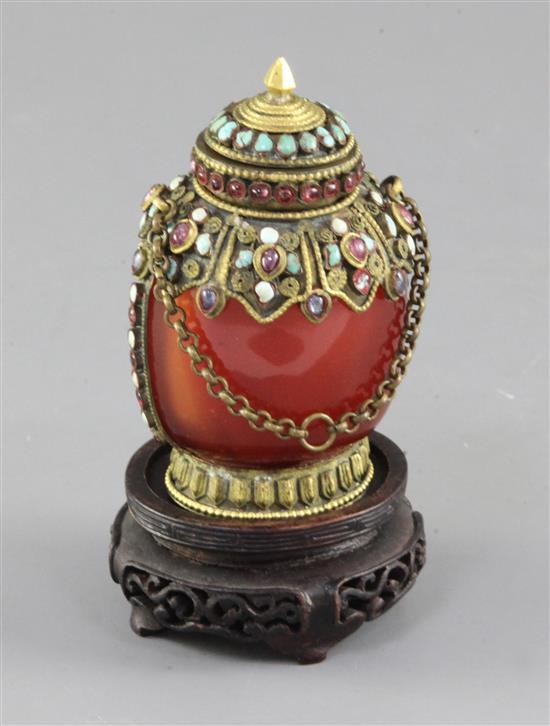 A Chinese faux chalcedony glass gilt metal and gem set snuff bottle and stopper, late 19th / early 20th century, height 10cm, wood stan